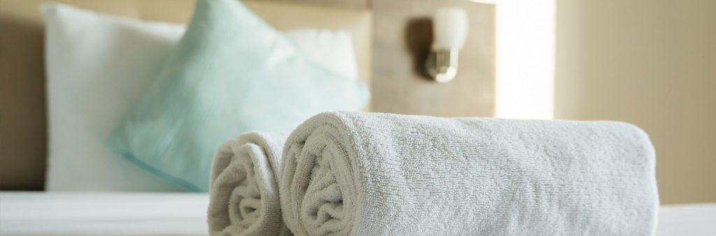 Close up of towel on hotel room bed