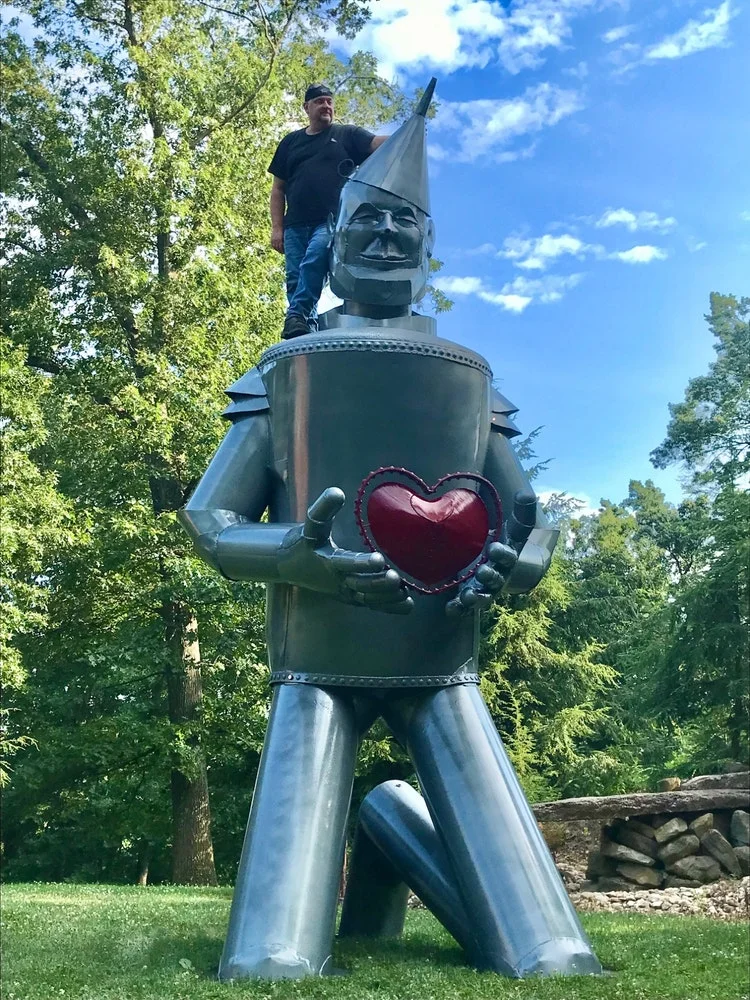 Bill Secund with the 24-foot tin man sculpture for Hart