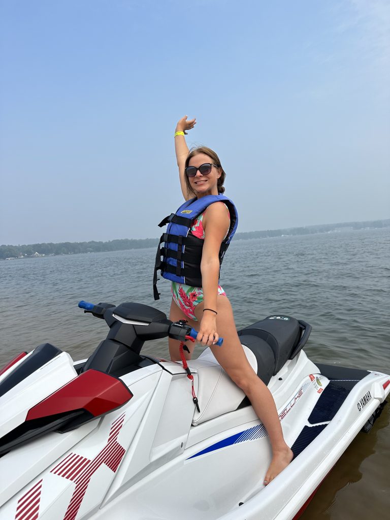 Girl posing on wave runner